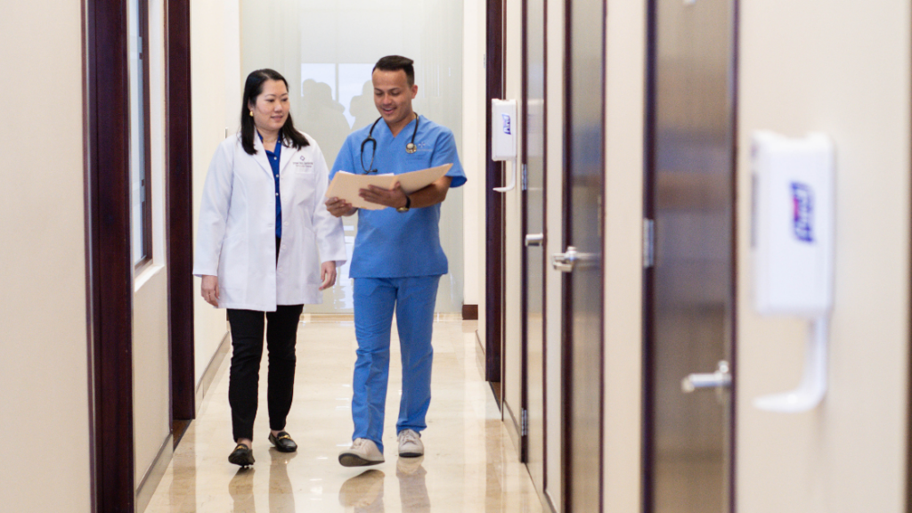 Doctor and nurse discussing a patient's medical file who is undergoing stem cell therapy anti aging