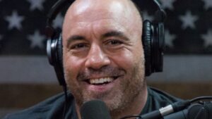 close-up of Joe Rogan smiling in his studio