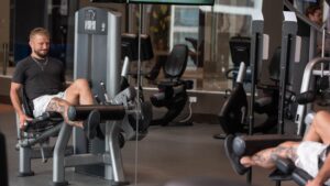 Man using a leg exercise machine in the gym