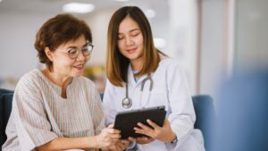 Patient talking to receptionist about their stem cell therapy