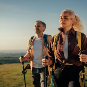 middle-aged woman and man hiking