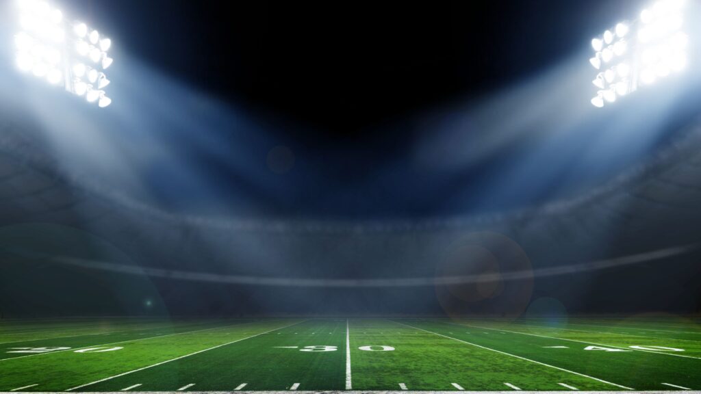 football stadium at night with lights on